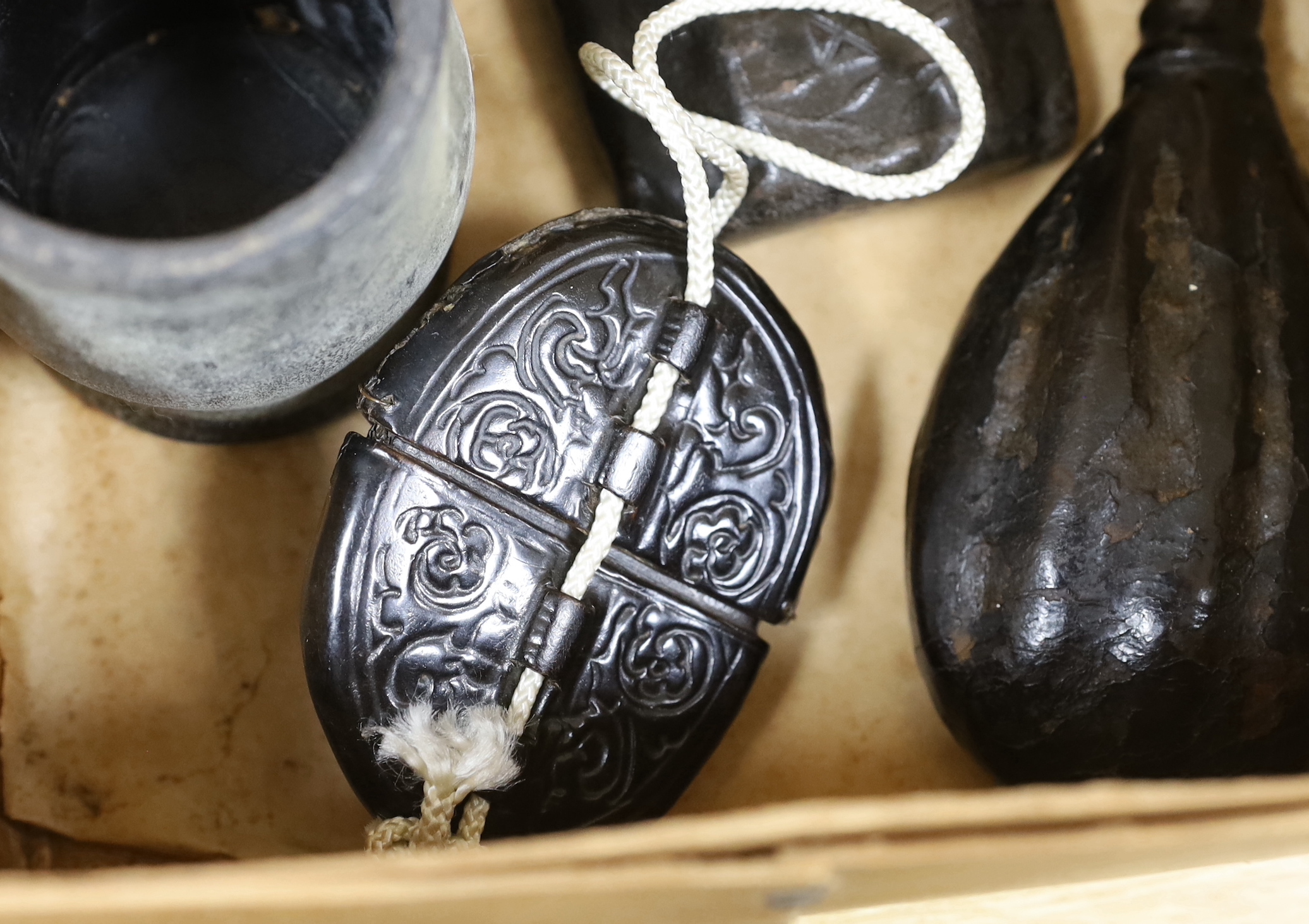 A quantity of stamped leather items including two flasks, two small tankards etc, largest flask 25cm high